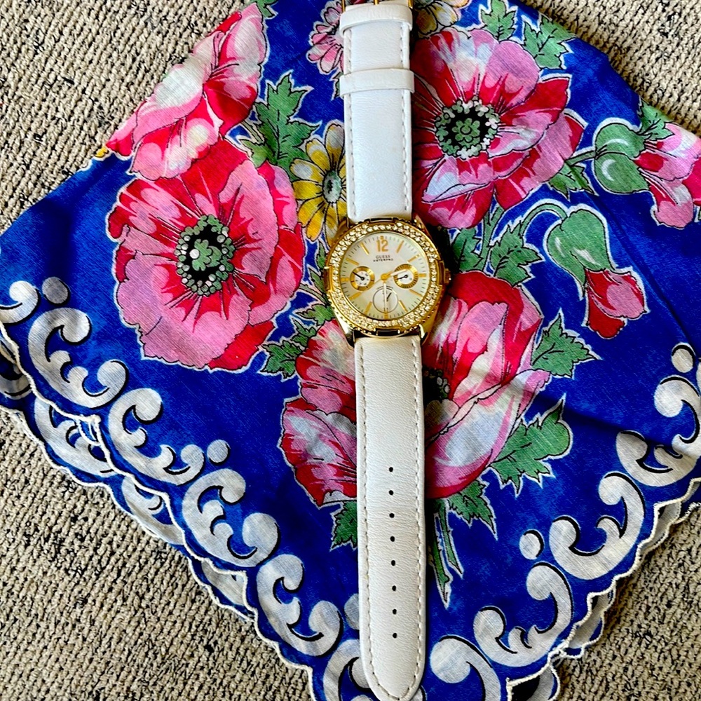 Ladies Guess white leather wrist watch.